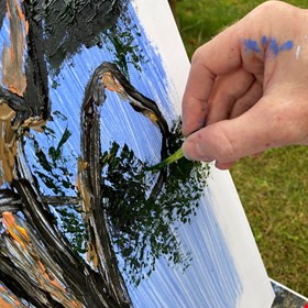 Using a broccoli to paint a blue atlas cedar at Shrewsbury School