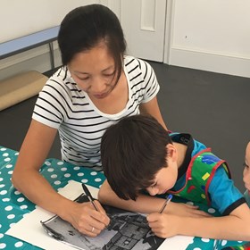 Family drawing together in our learning studio