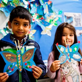 Children with their beautiful blue morpho butterflies