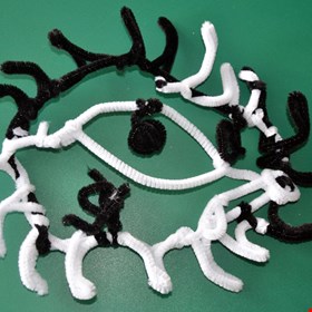 Drawing abstract eyes with pipe cleaners at Punnetts Town Primary School