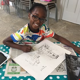 Girl drawing a picture in our Learning Studio